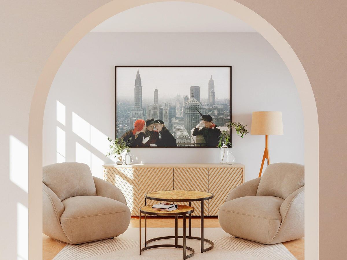 1950s New York City wall art seen through an arched doorway above a wood sideboard