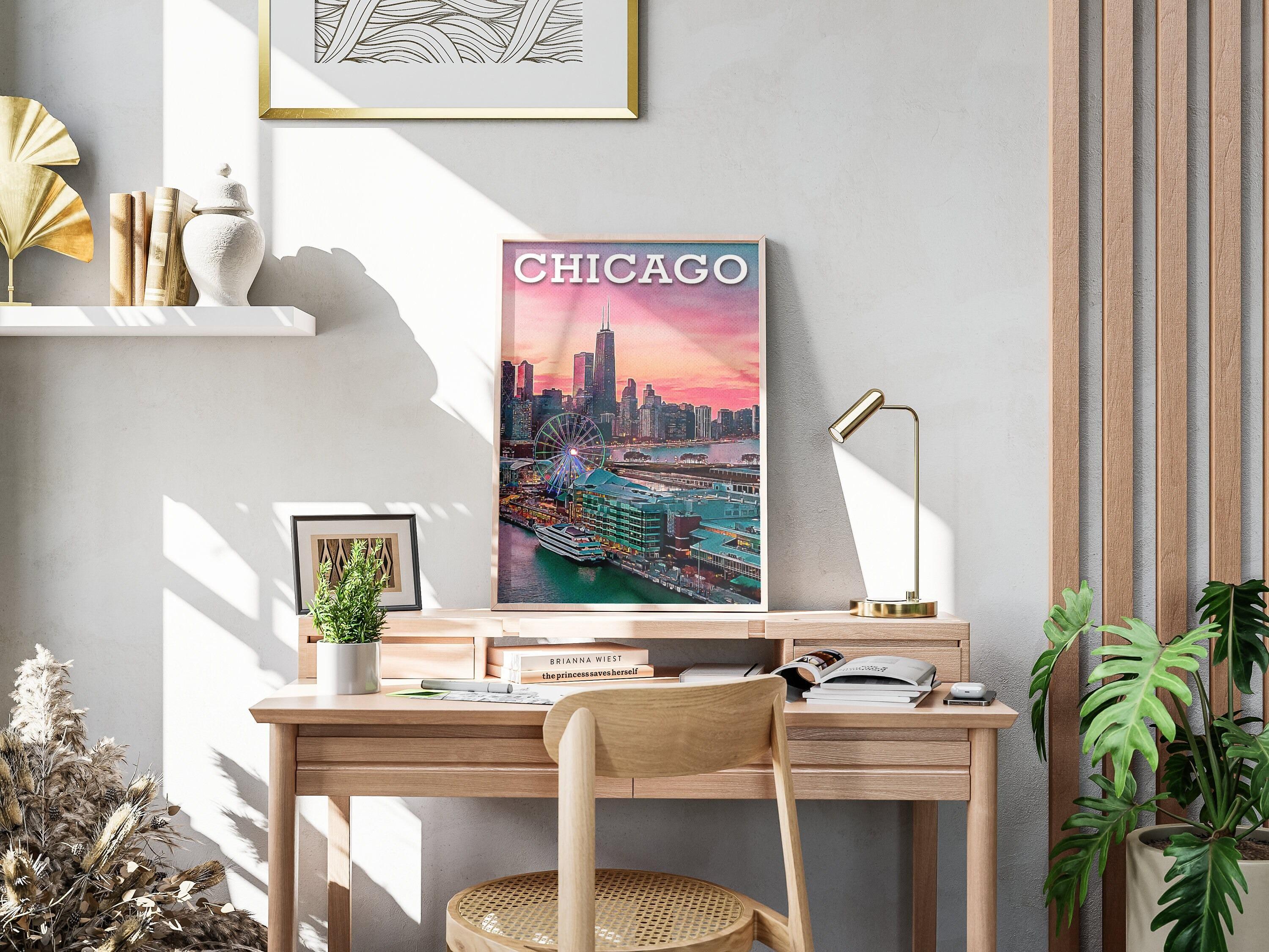 Chicago travel print on a wooden desk with brass lamp, warm shadows and monstera plant