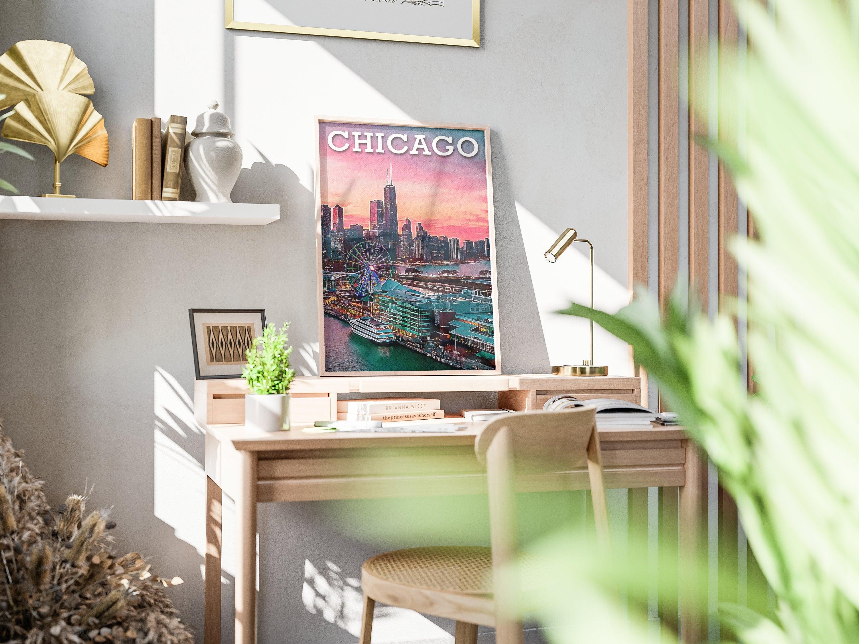 Chicago skyline poster in light wood frame on a sunlit desk with books and plant