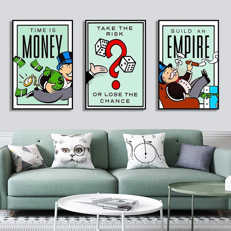 Set of 3 Monopoly style motivational posters above a mint green sofa in a modern grey living room.